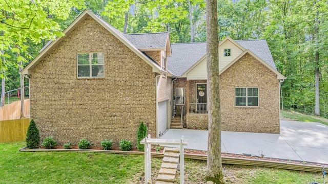 front facade with a garage and a front lawn