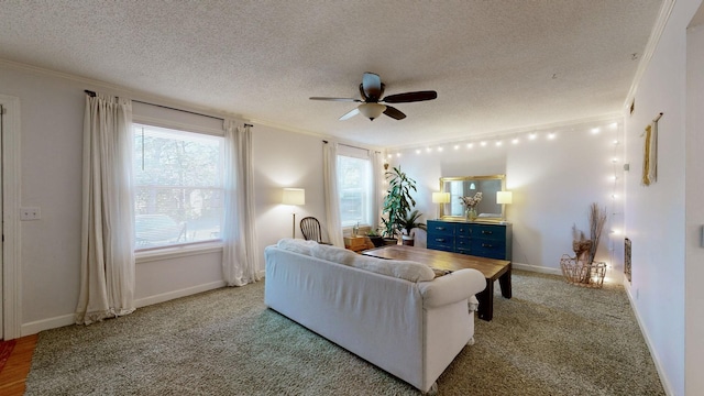 bedroom with a textured ceiling, ceiling fan, and crown molding