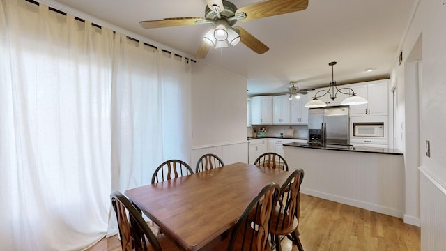 dining room with light hardwood / wood-style flooring