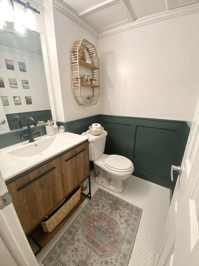 bathroom featuring crown molding, vanity, and toilet