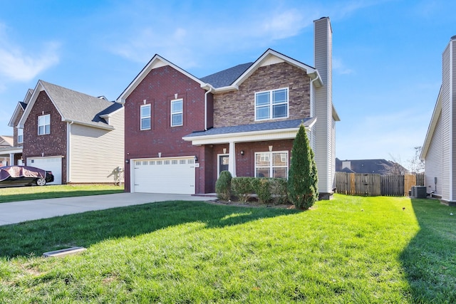 view of front of house featuring cooling unit, a garage, and a front yard