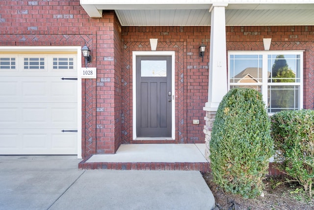 doorway to property featuring a garage