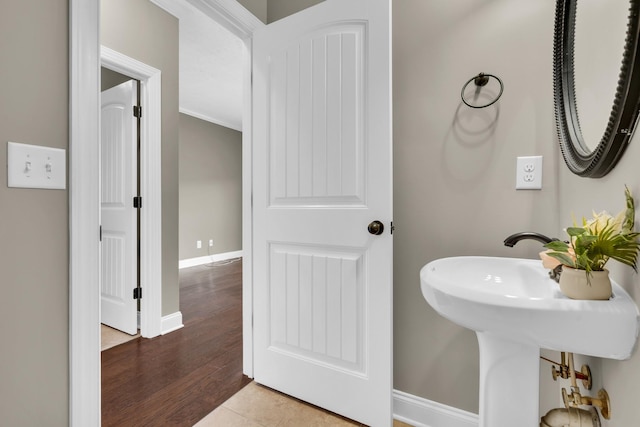 bathroom with wood-type flooring