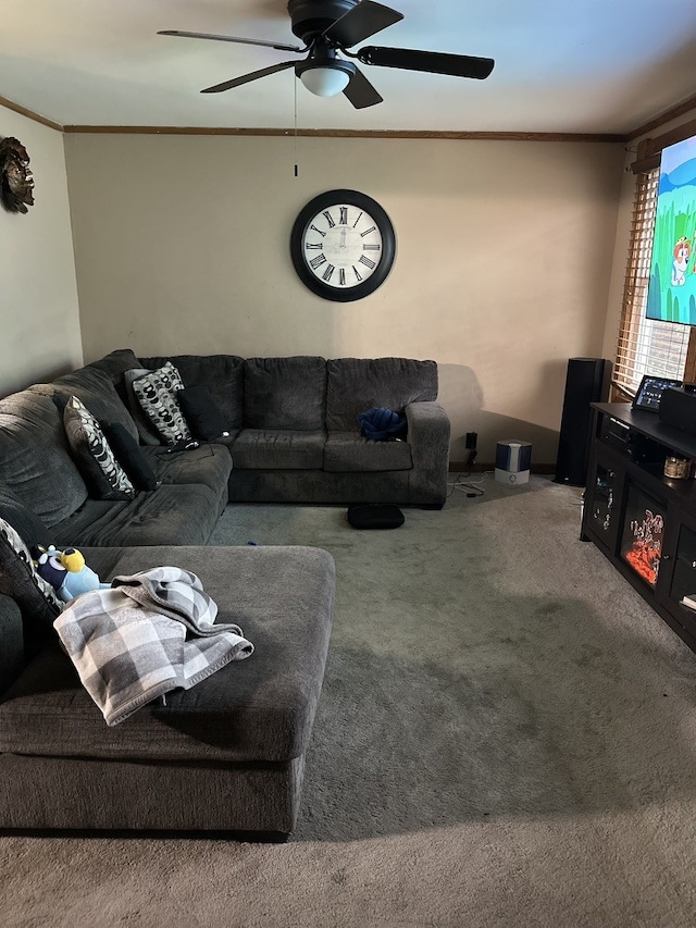 carpeted living room featuring ceiling fan and crown molding