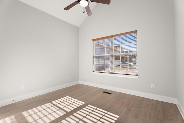 unfurnished room with light hardwood / wood-style flooring, high vaulted ceiling, and ceiling fan