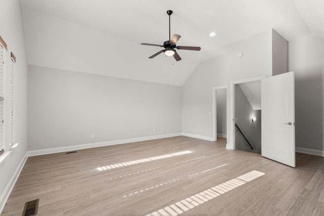 additional living space featuring vaulted ceiling, ceiling fan, and light wood-type flooring