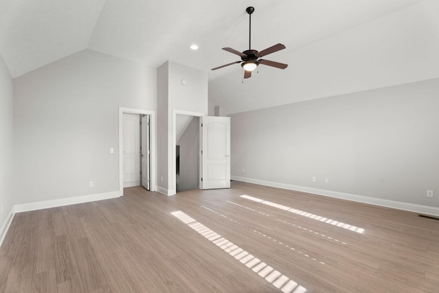 unfurnished bedroom with ceiling fan, high vaulted ceiling, and light hardwood / wood-style floors