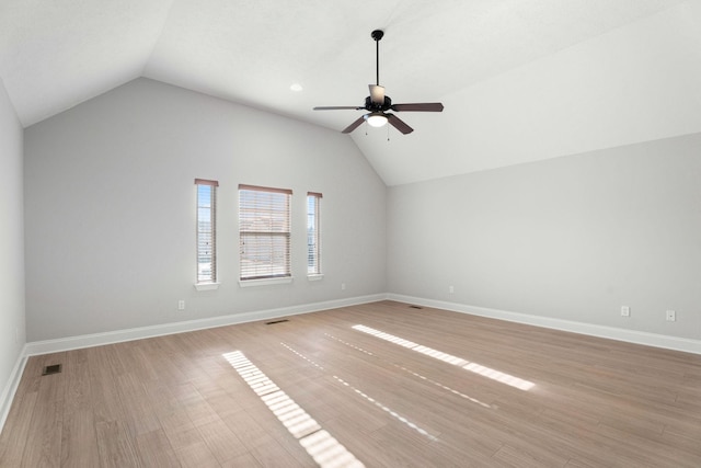 interior space featuring ceiling fan, lofted ceiling, and light hardwood / wood-style floors