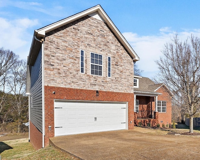 view of side of home featuring a garage