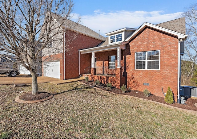 view of front of property with a porch, a garage, and a front yard