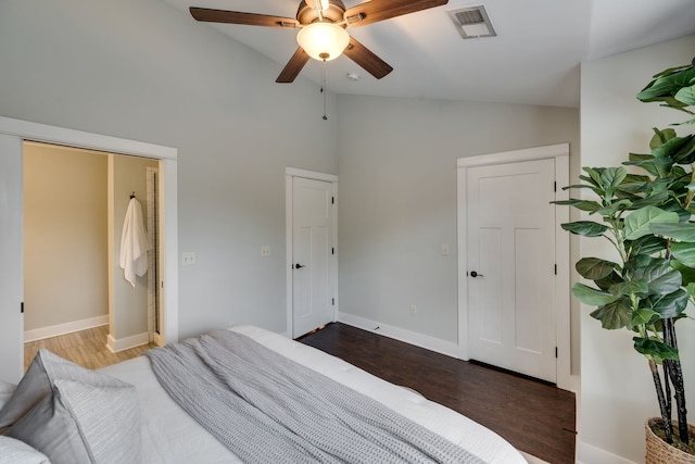 bedroom featuring vaulted ceiling, ceiling fan, and dark hardwood / wood-style floors