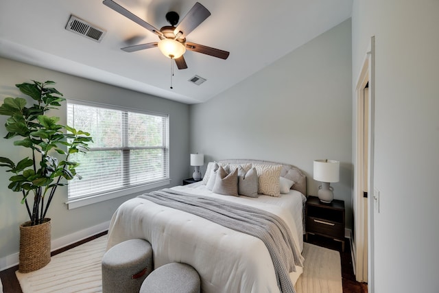 bedroom featuring lofted ceiling, hardwood / wood-style floors, and ceiling fan