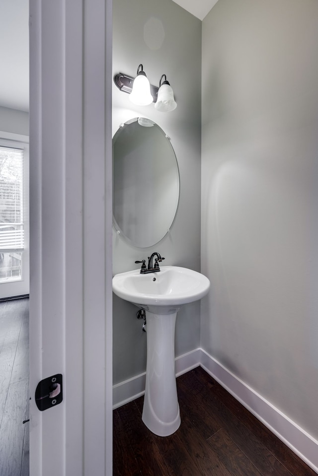 bathroom with wood-type flooring