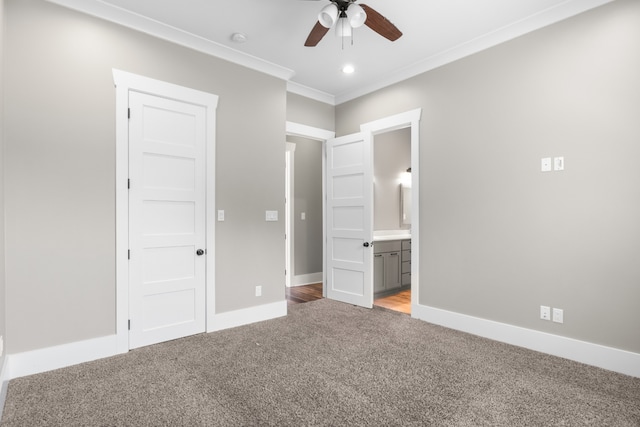 unfurnished bedroom with light colored carpet, ceiling fan, crown molding, and connected bathroom