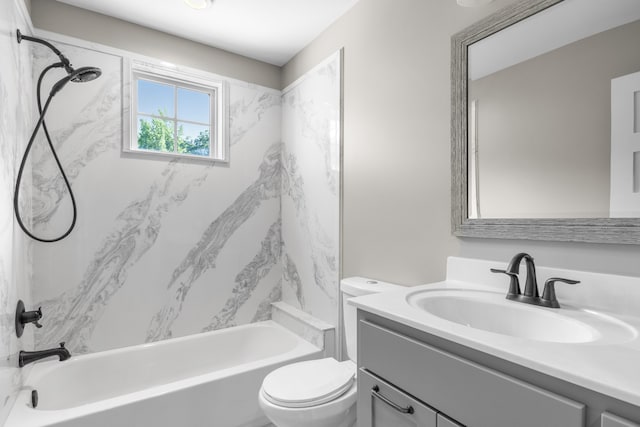 full bathroom featuring vanity, tiled shower / bath combo, and toilet