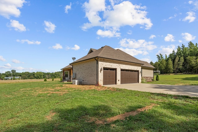 view of side of home featuring a garage, central air condition unit, and a lawn