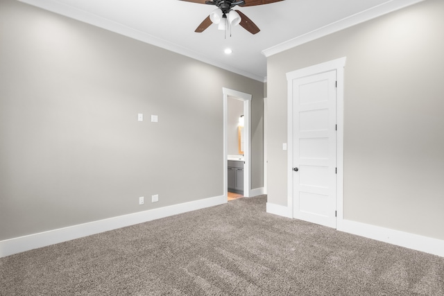 unfurnished room with ceiling fan, carpet flooring, and crown molding