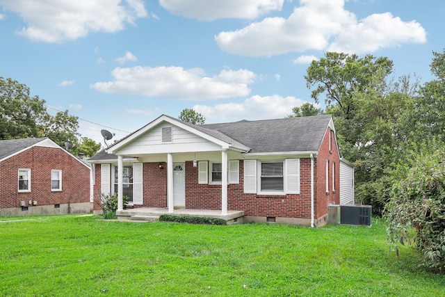 view of front of property featuring a porch, a front lawn, and central air condition unit