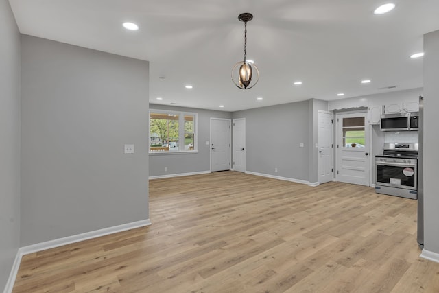 unfurnished living room featuring light hardwood / wood-style flooring