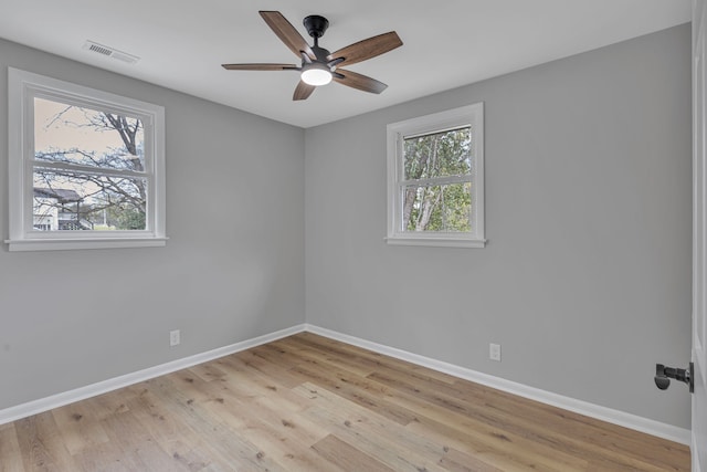 empty room featuring light hardwood / wood-style flooring and ceiling fan