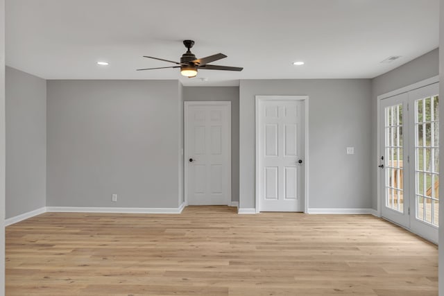 spare room with light hardwood / wood-style floors and ceiling fan