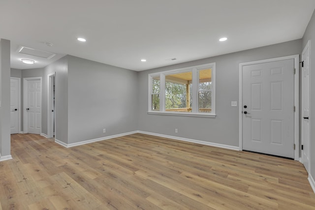 foyer entrance with light hardwood / wood-style floors