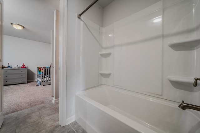 bathroom featuring tile patterned flooring and shower / bath combination