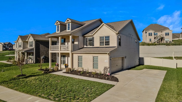 view of front of property with a balcony, a front lawn, and a garage