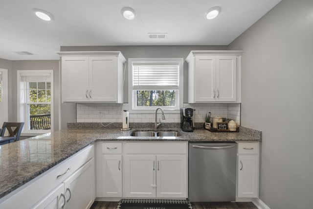 kitchen featuring dark hardwood / wood-style flooring, white cabinetry, sink, and dishwasher