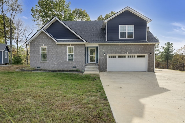 view of front of property featuring a garage and a front yard