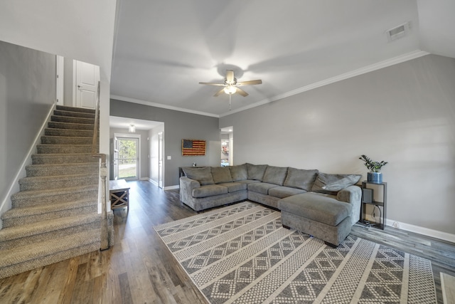 living room featuring ornamental molding, dark hardwood / wood-style flooring, and ceiling fan