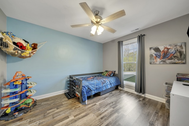 bedroom featuring hardwood / wood-style floors and ceiling fan