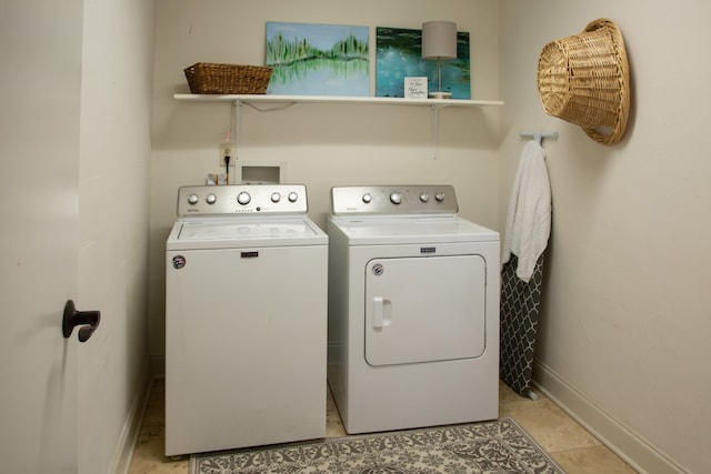 washroom with light tile patterned floors and independent washer and dryer