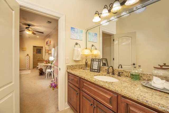 bathroom with ceiling fan and vanity