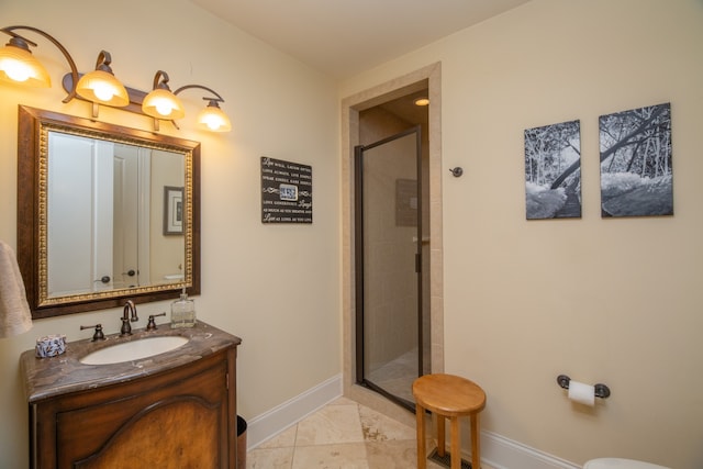 bathroom with walk in shower, vanity, and tile patterned floors