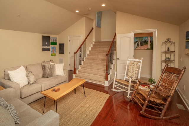 living room featuring hardwood / wood-style floors and lofted ceiling