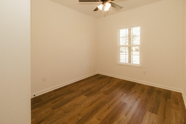 empty room featuring dark hardwood / wood-style floors and ceiling fan