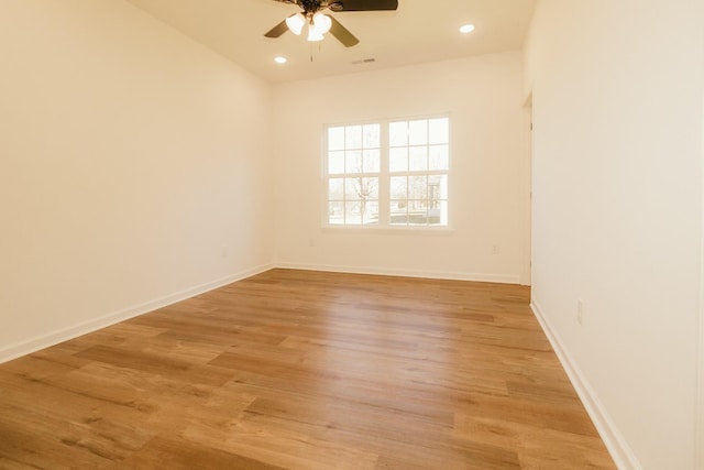 spare room with ceiling fan and light hardwood / wood-style flooring