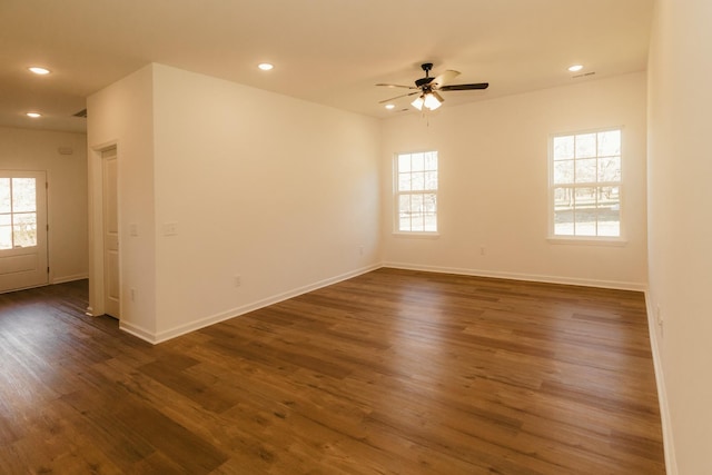 unfurnished room featuring ceiling fan and dark hardwood / wood-style floors