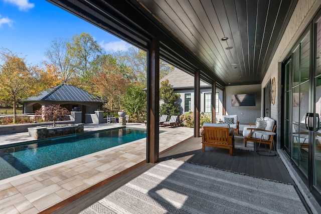 view of swimming pool with a deck and a patio area