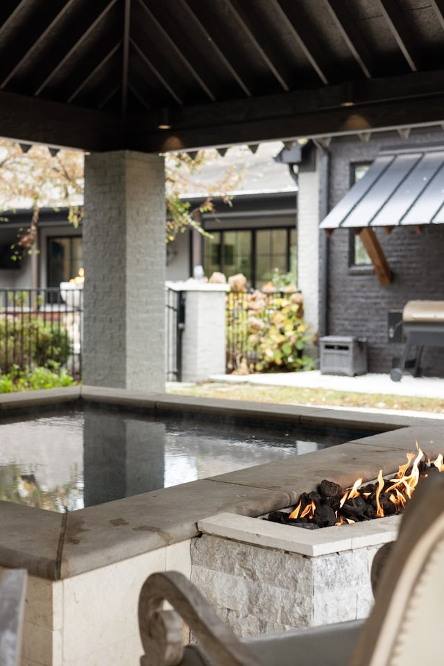 exterior details featuring a fire pit