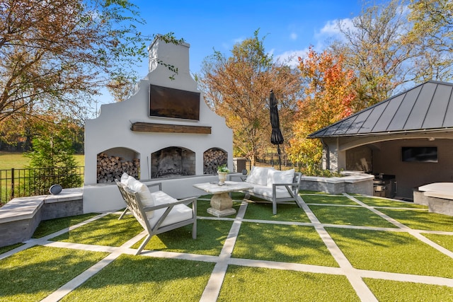 view of patio featuring an outdoor living space with a fireplace