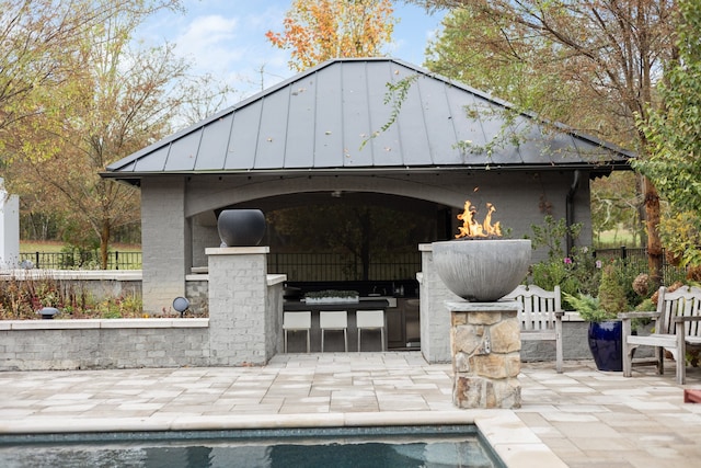 exterior space featuring a gazebo and a bar