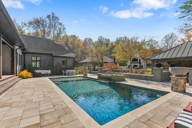 view of pool featuring an outdoor hangout area and a patio area