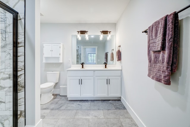 bathroom with vanity, toilet, and a shower with shower door