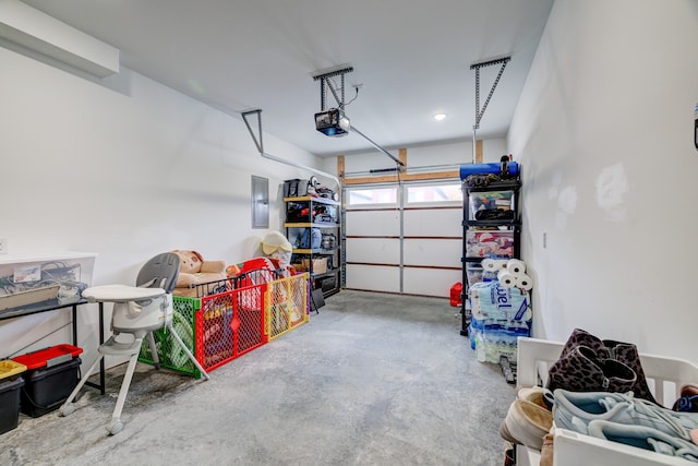 garage featuring a garage door opener and electric panel