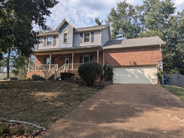 view of front of home featuring a garage and covered porch