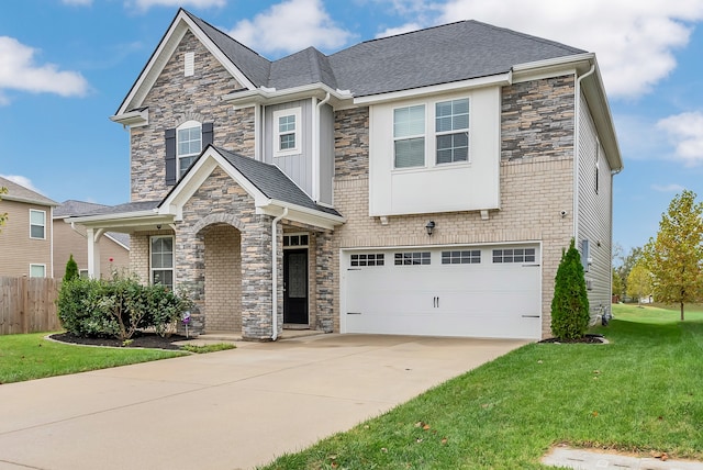 view of front of house featuring a garage and a front lawn