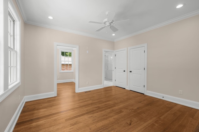 unfurnished bedroom featuring crown molding, ceiling fan, and light hardwood / wood-style flooring