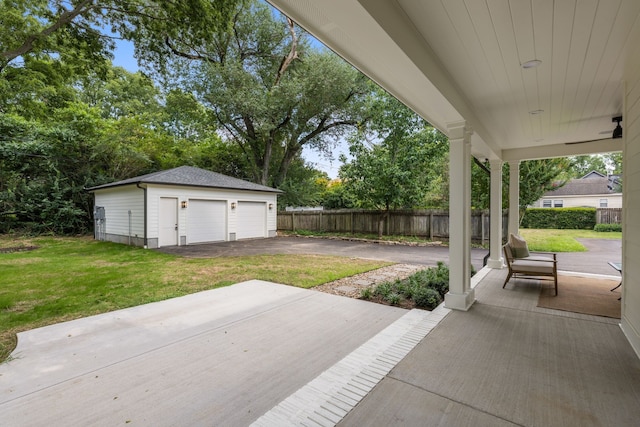 view of patio / terrace with an outbuilding and a garage